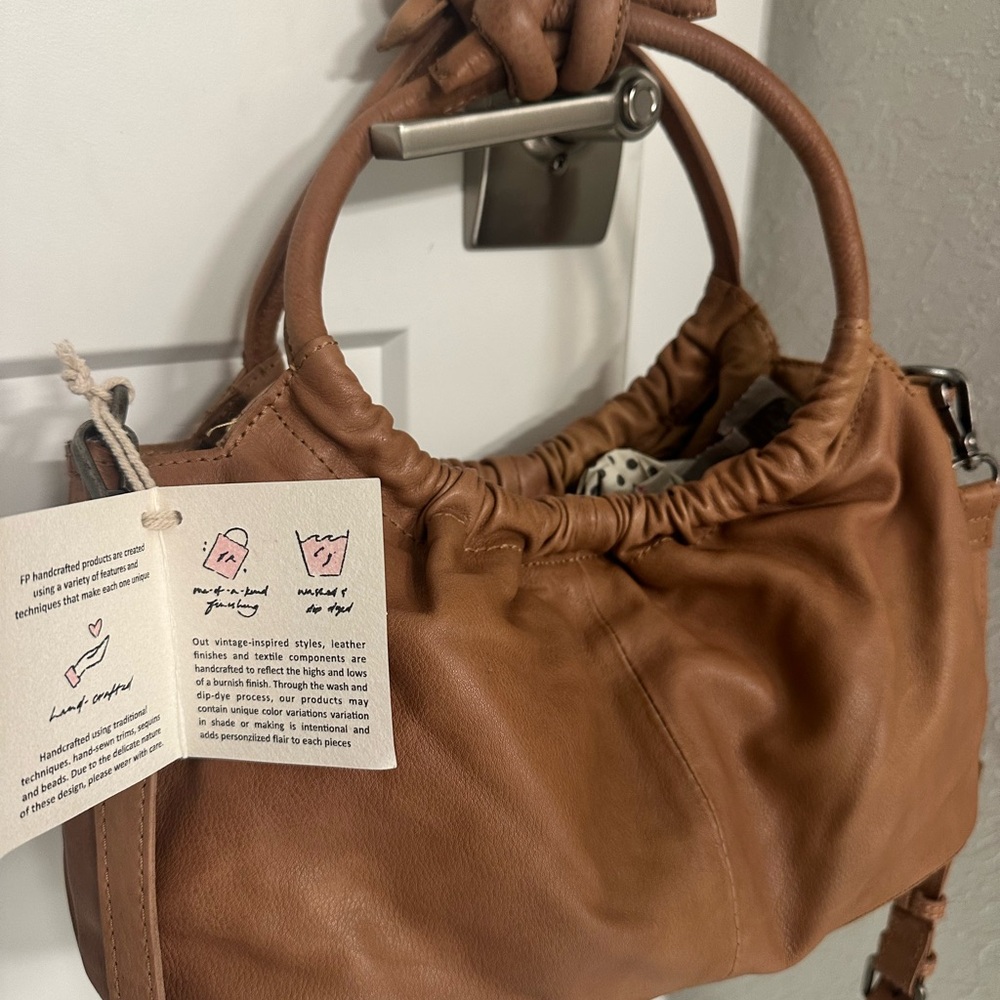 NWT Free People Brown Leather Handbag with adjustable straps. For any occasion.